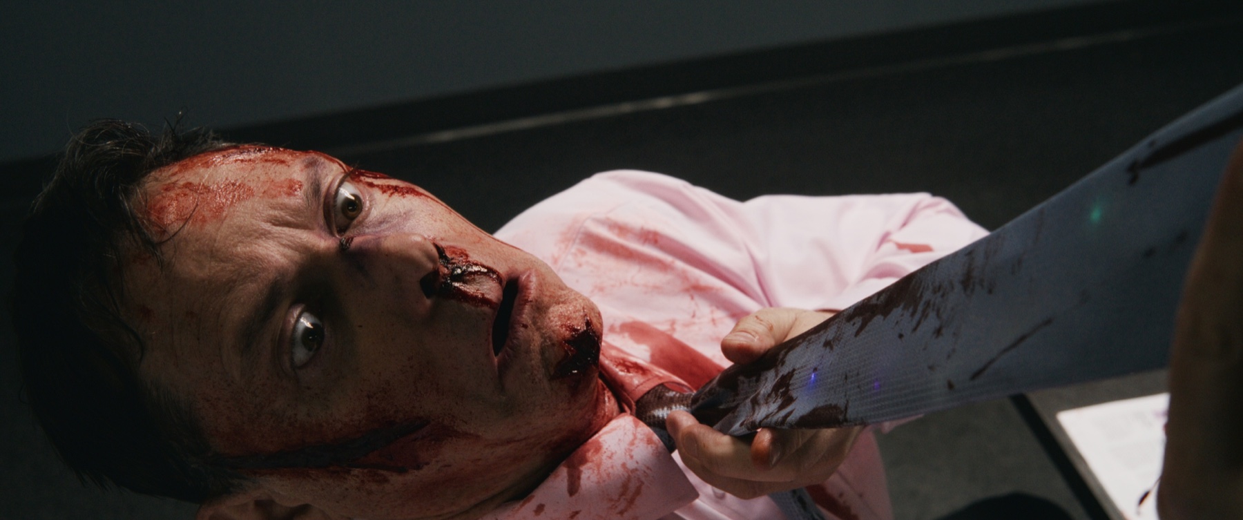A cinematic frame from Tie Die